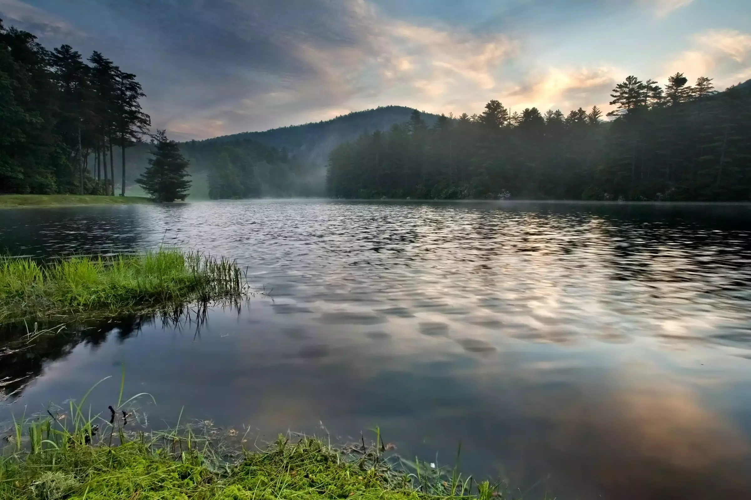 lake with mountains in the background